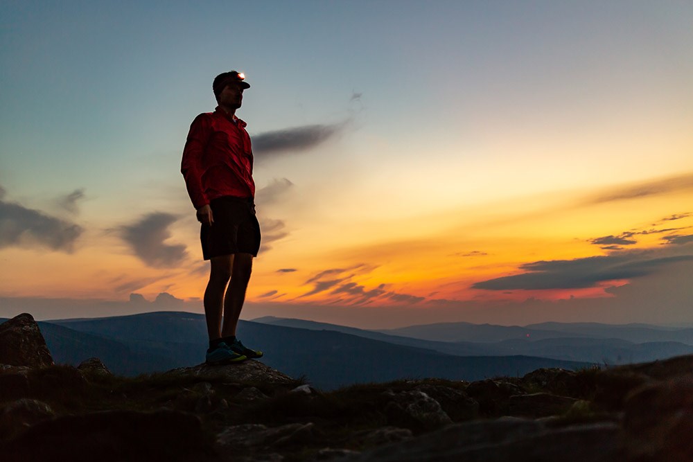 Trail runner with head lamp.