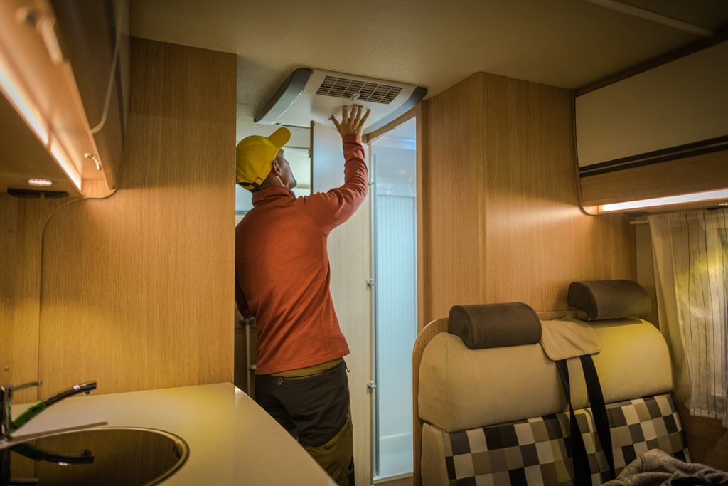Man inspecting the interior of an RV.
