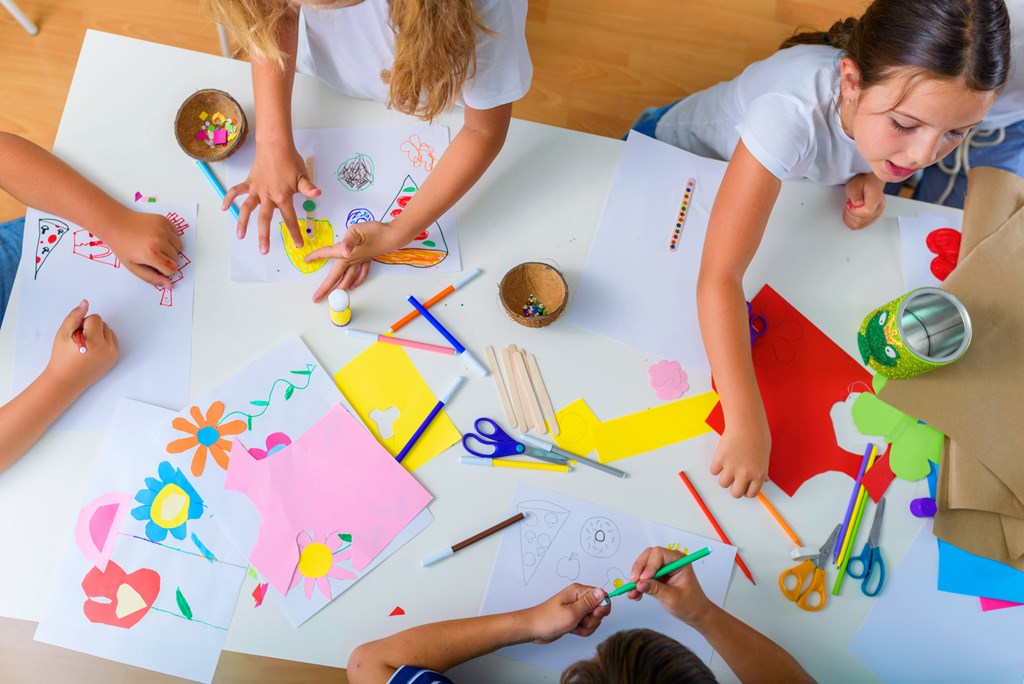 Overhead view of kids working on art projects.