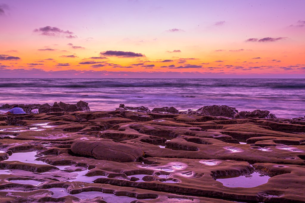 Colorful and vibrant sunset over the tide pools at beautiful La Jolla, CA coastline.