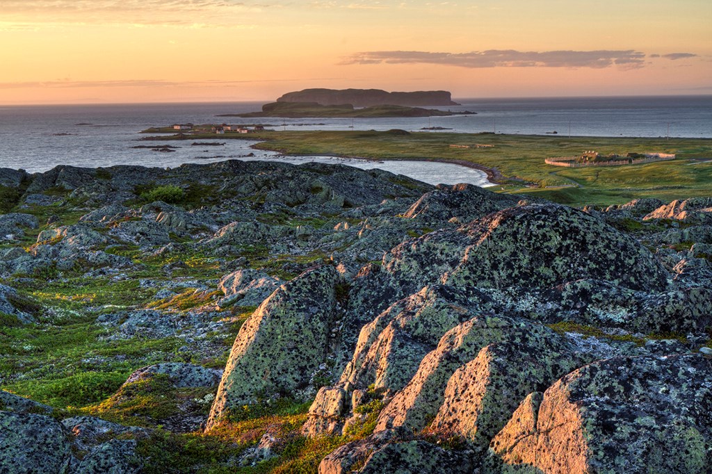 Sunset seen from a rocky hill overlooking the Viking settlement at L'Anse Aux Meadows National Historic Site in Northern Newfoundland (HDR)