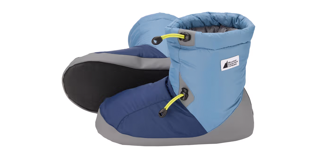 A pair of cushioned booties on a white background.
