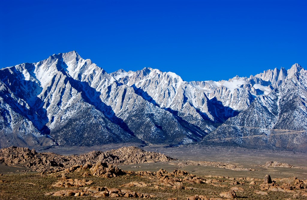 Mount Whitney rises from the Alabama Hills in California.