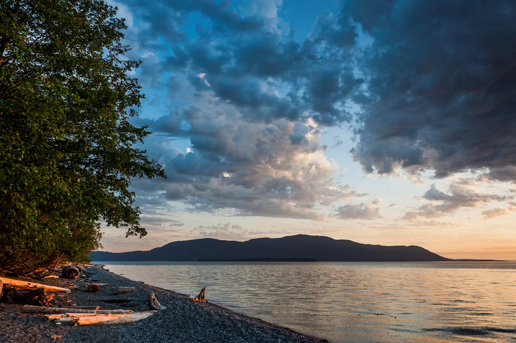 A beautiful sunset seen across Rosario Strait from Lummi Island to Orcas Island in the Puget Sound area of western Washington State.