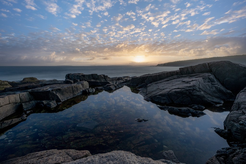 Beautiful sunset reflections from Otter Point in Acadia National Park in Maine.