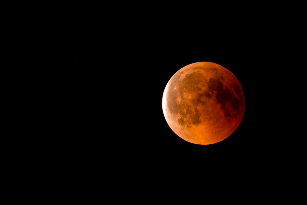 A close shot of the moon during a partial lunar eclipse.