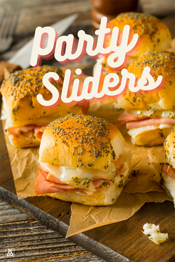 Make our easy grilled party sliders to please a whole group of hungry campers. This easy grilled ham and cheese slider recipe is sure to please!