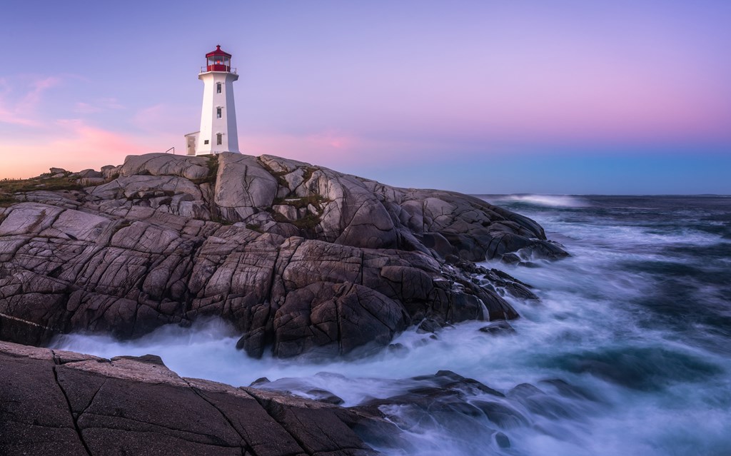 Lighthouse at Peggys Cove in Canada at dusk.