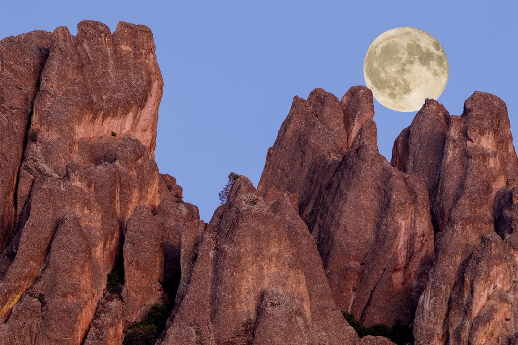A full moon rises over Pinnacles National Park.