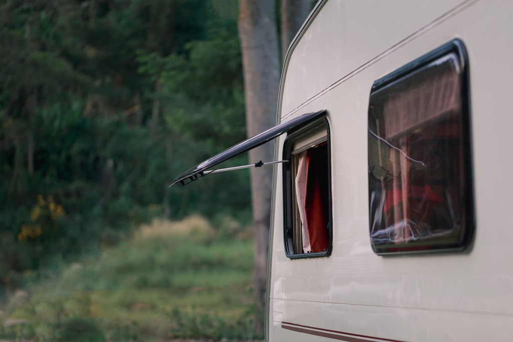 Close up of camper van with window open 