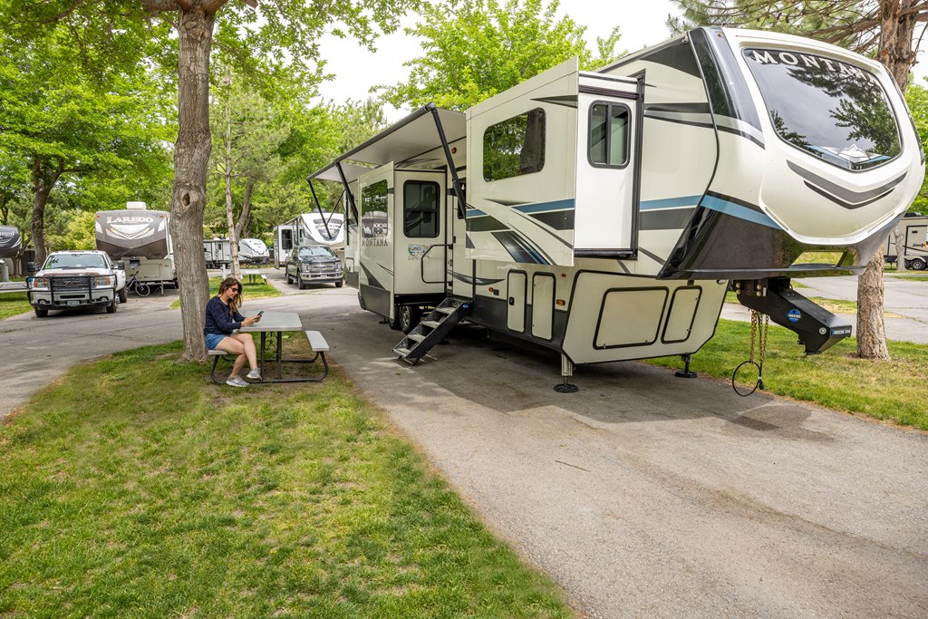 Fifth-wheel RV with slideouts on a Pull-Thru RV Site at KOA.