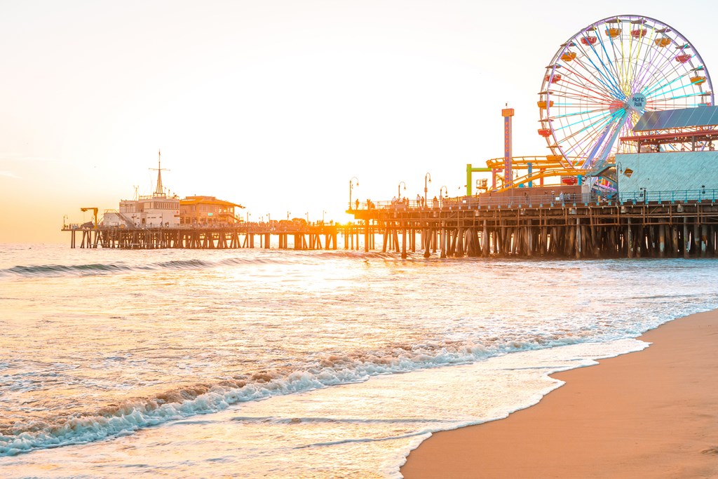 Santa Monica Pier on the background of an orange sunset