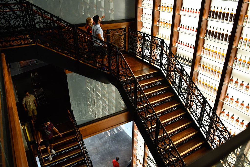A view of an elaborate, multi-story staircase at the Sazerac House.