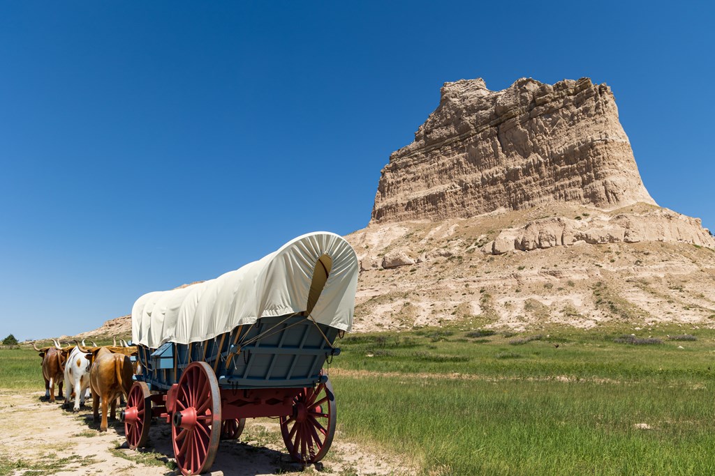 Covered wagon in front of Scotts Bluff National Monument near Gering, Nebraska.