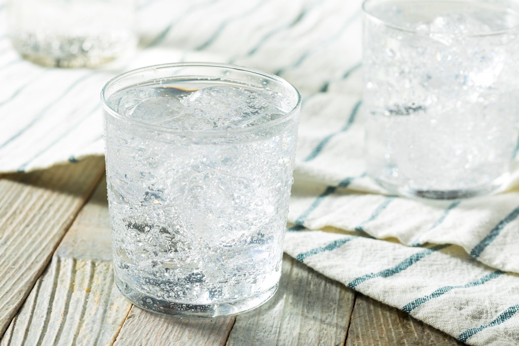 Fresh Spring Sparkling Water with Ice in a Glass.