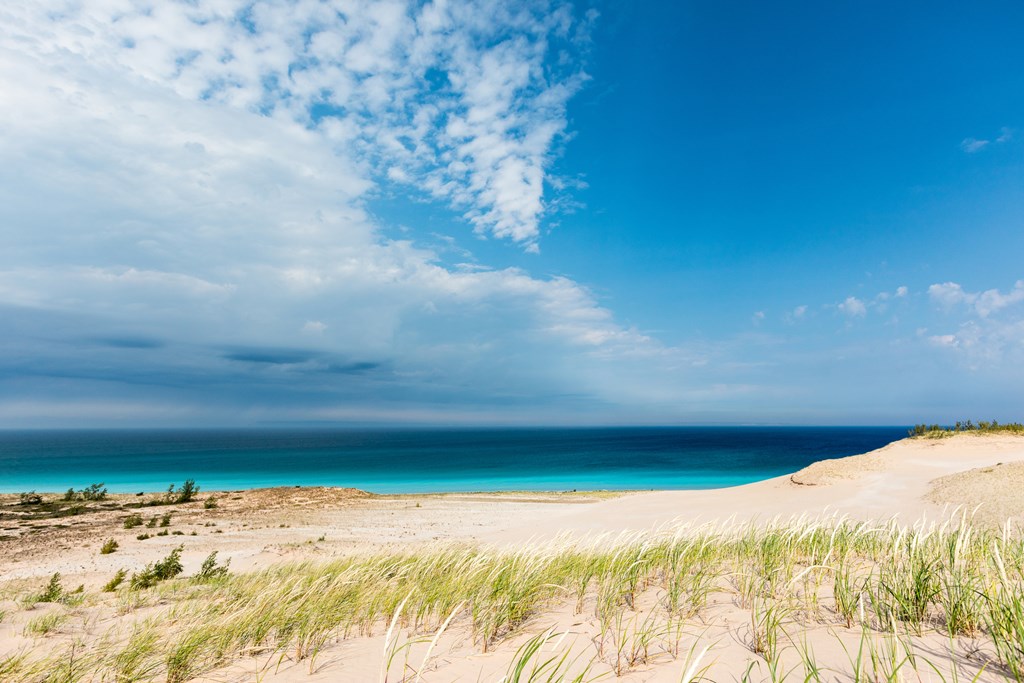 Azure blue skies and the waters of Lake Michigan are the background at Sleeping Bear Dunes National Lakeshore in Glen Haven, Michigan.