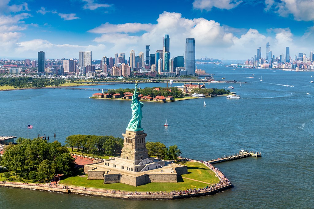 Panoramic aerial view Statue of Liberty and Jersey City and Manhattan cityscape in New York City, NY.