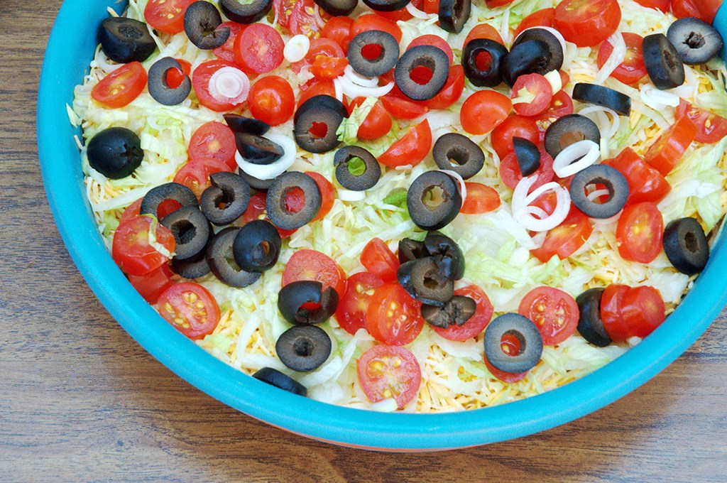 An appetizer of layered bean dip.