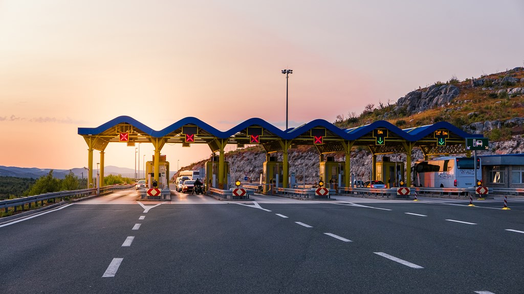 Cars passing through the toll gate on the motorway