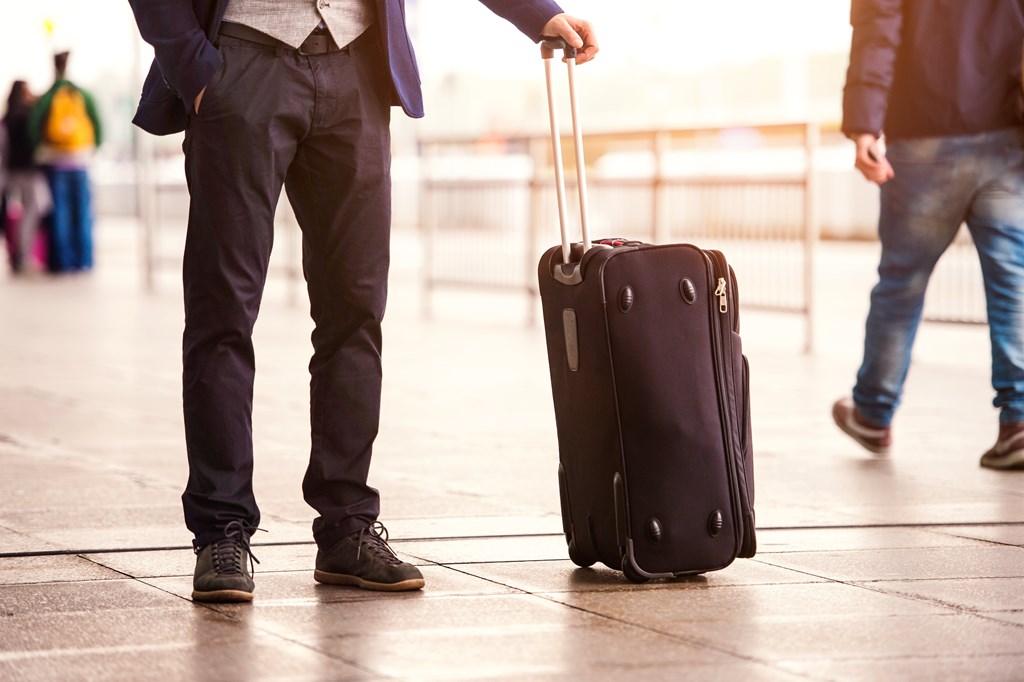 Close up of man with a rolling suitcase helps set the scene for this funny scary story for kids