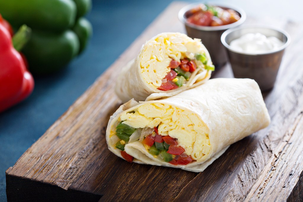 Vegetarian breakfast burrito with eggs and bell pepper