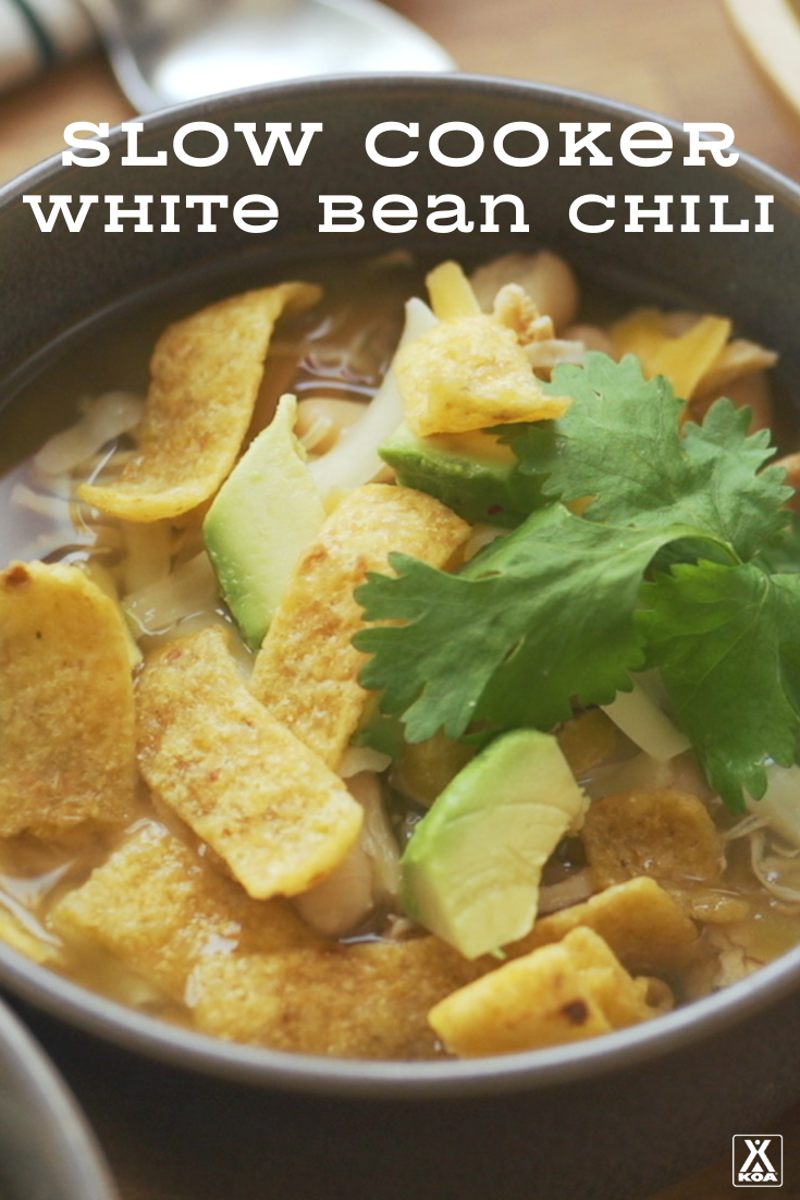 Add a little warmth to cold days with this easy white bean chili slow cooker recipe. Make it at home, at your campsite or premake and heat up over the campfire.
