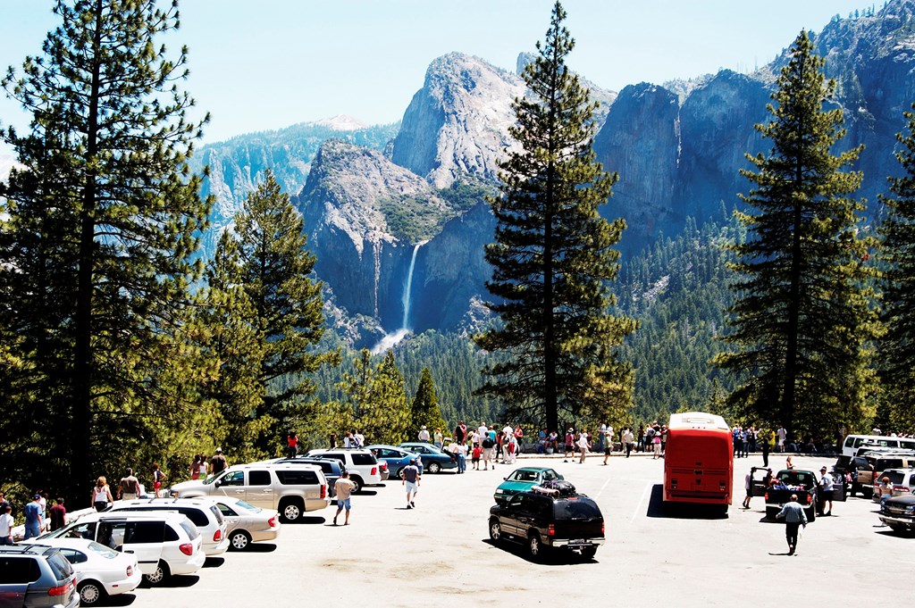 Tourists at the tunnel view overlook in Yosemite National Park.