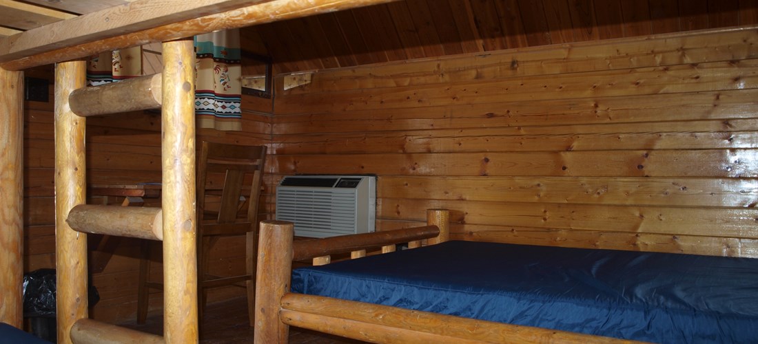 Full size bed and a set of bunk beds