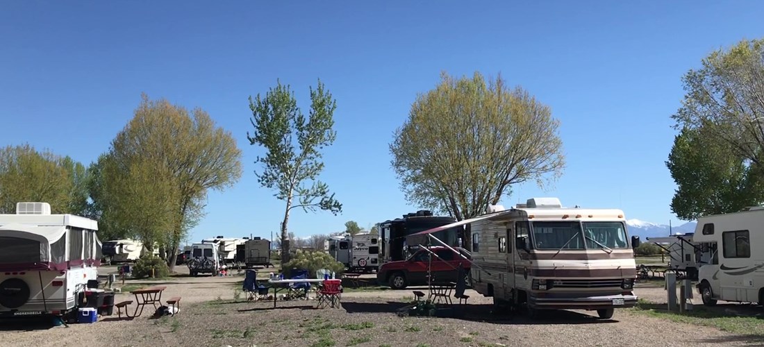 RVs face each other with common area for hanging out.