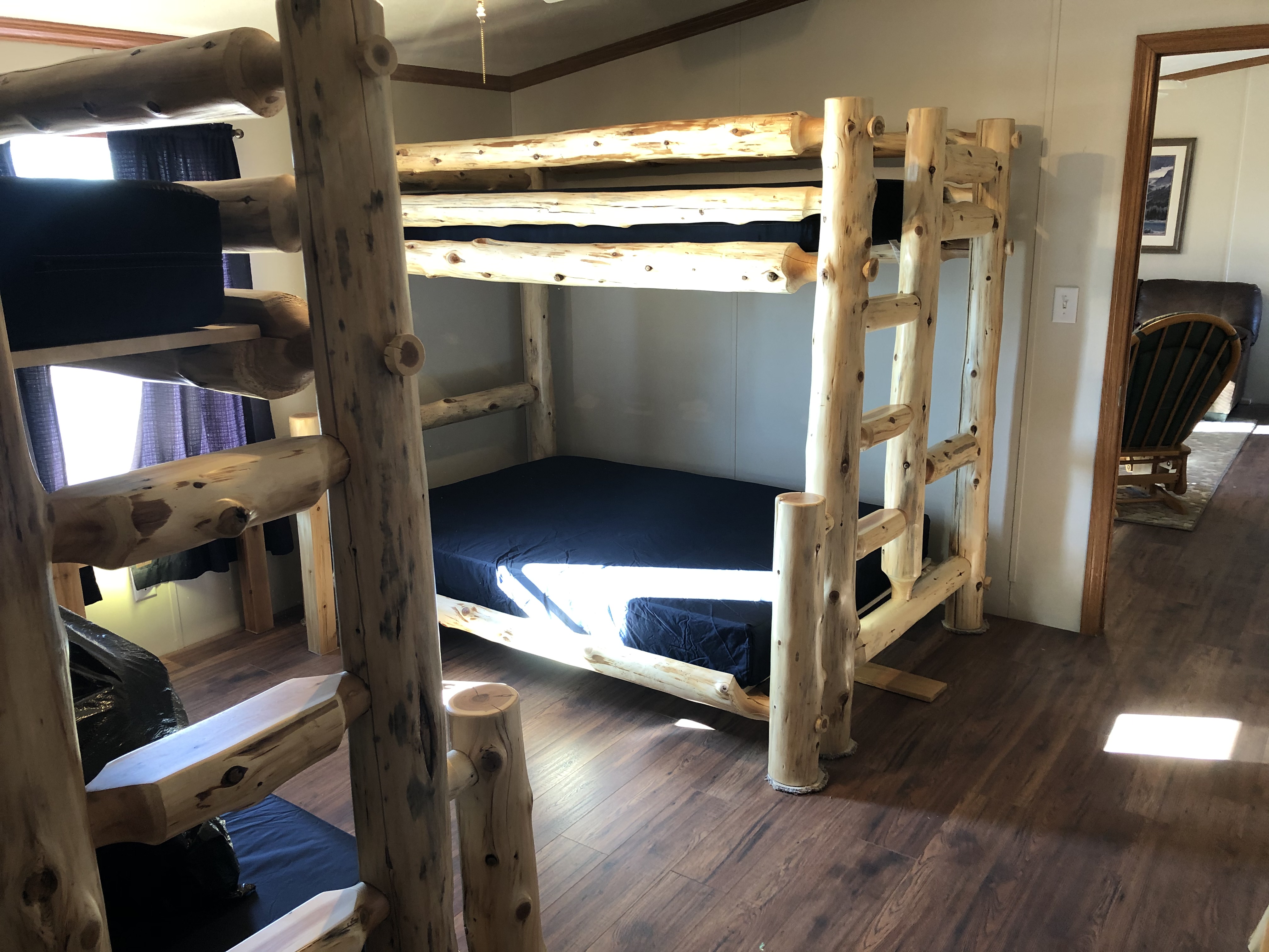 Bedroom #3 with two log bunkbeds .  Full on bottom, twin on top.
