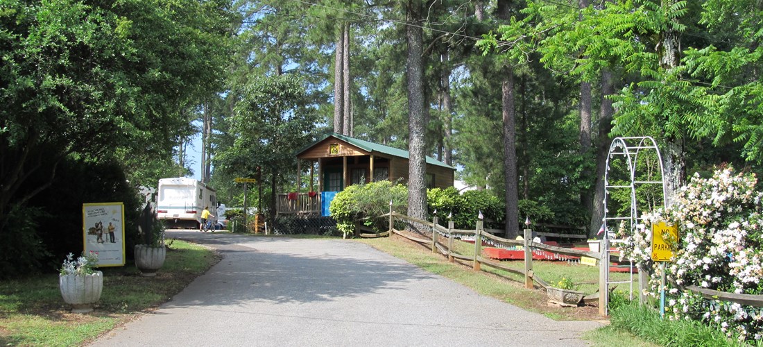 "Main St" into campground with Deluxe Cabin-Park Model on the right