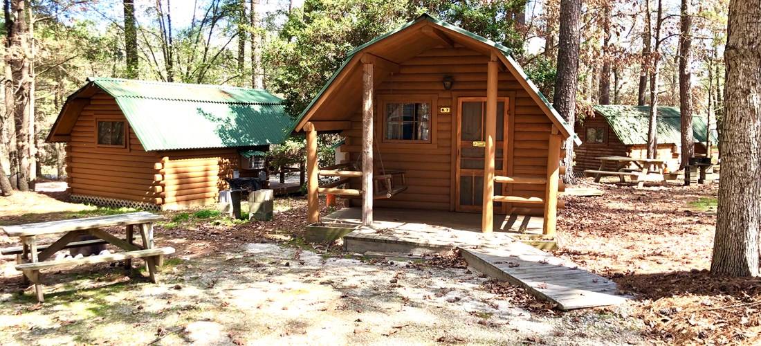 One room camping cabin (full size bed and one set of bunk beds) with mini-refrigerator and cable TV. Room for boat    parking nearby.