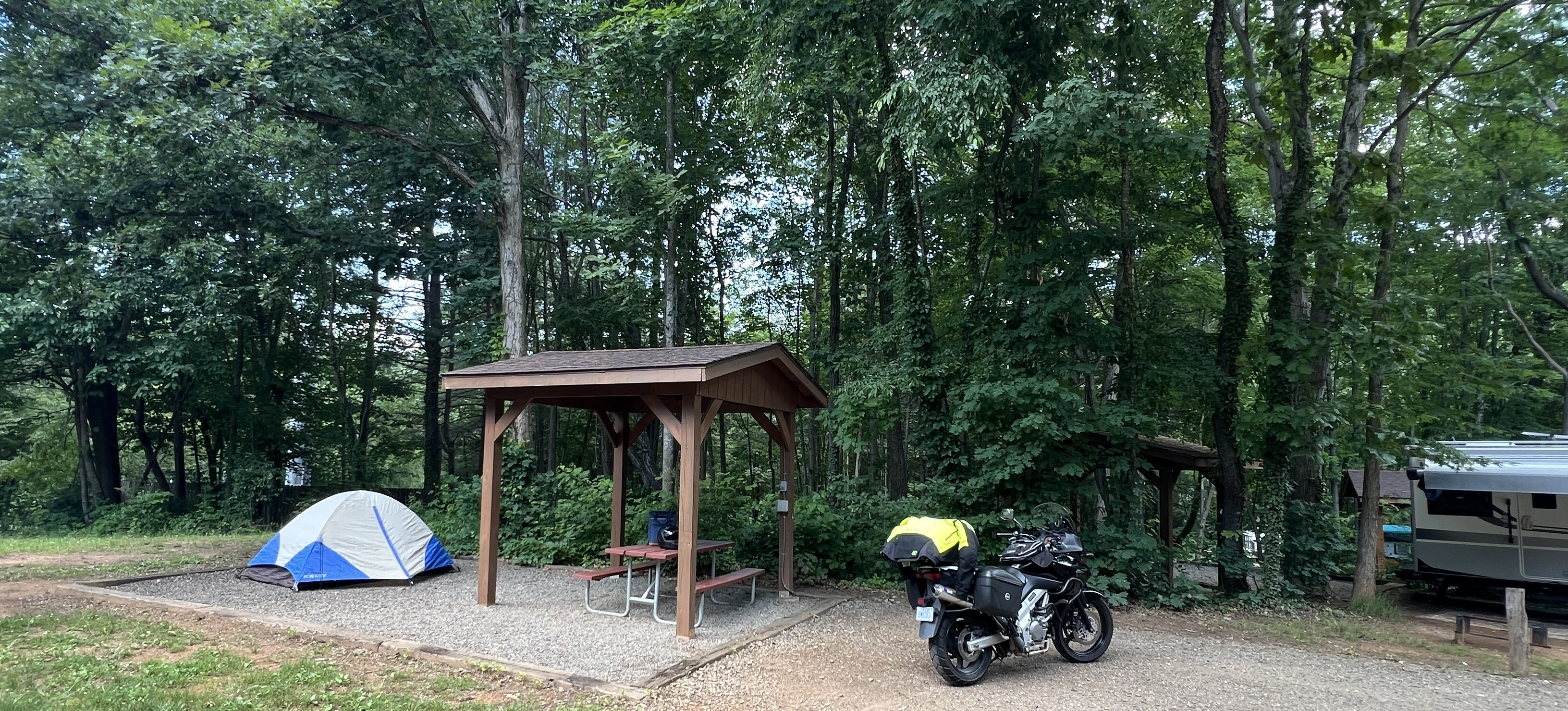Wide angle shot of motorcycle camping spot