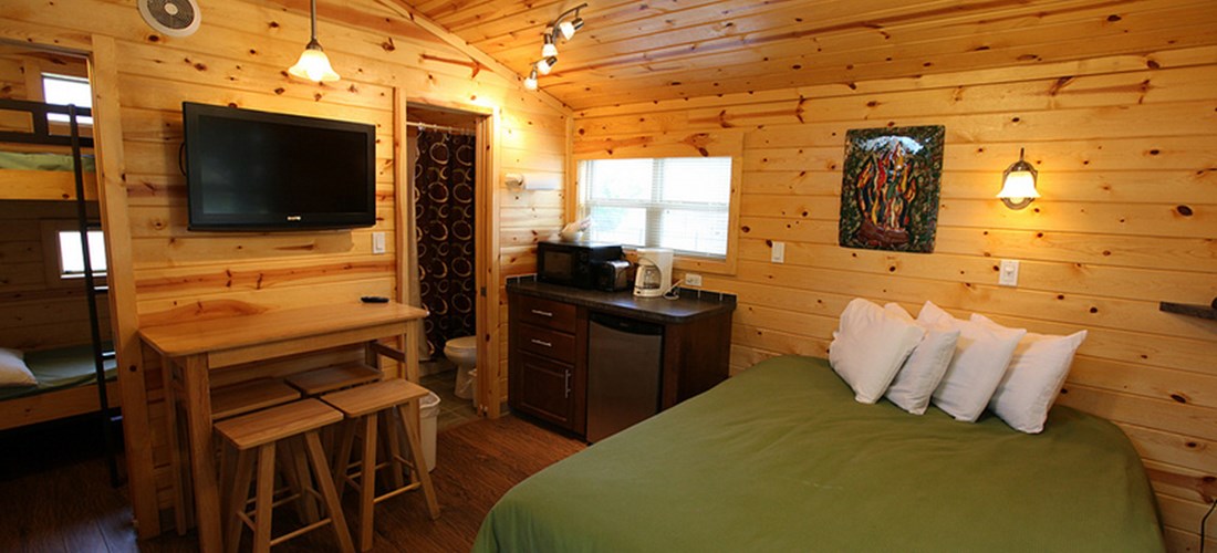 Our studio cabins have great main rooms with a queen bed.