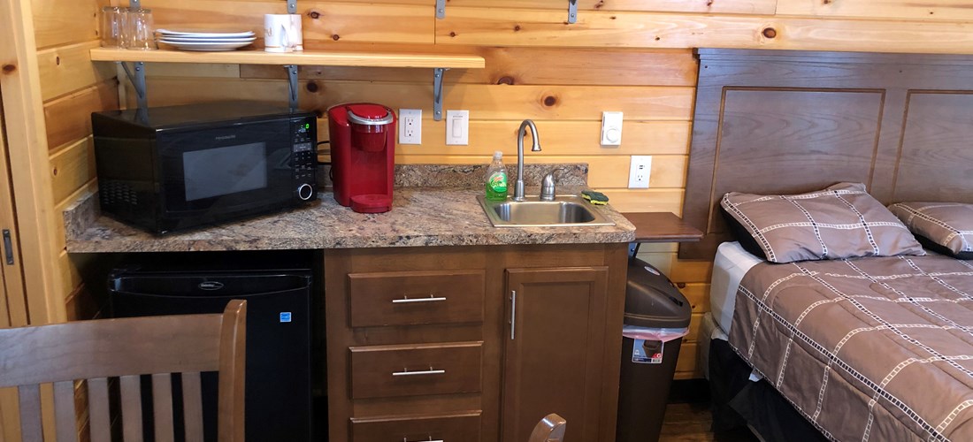 Half Kitchen, includes, small fridge, microwave, Keurig coffee maker, toaster and utensils.
