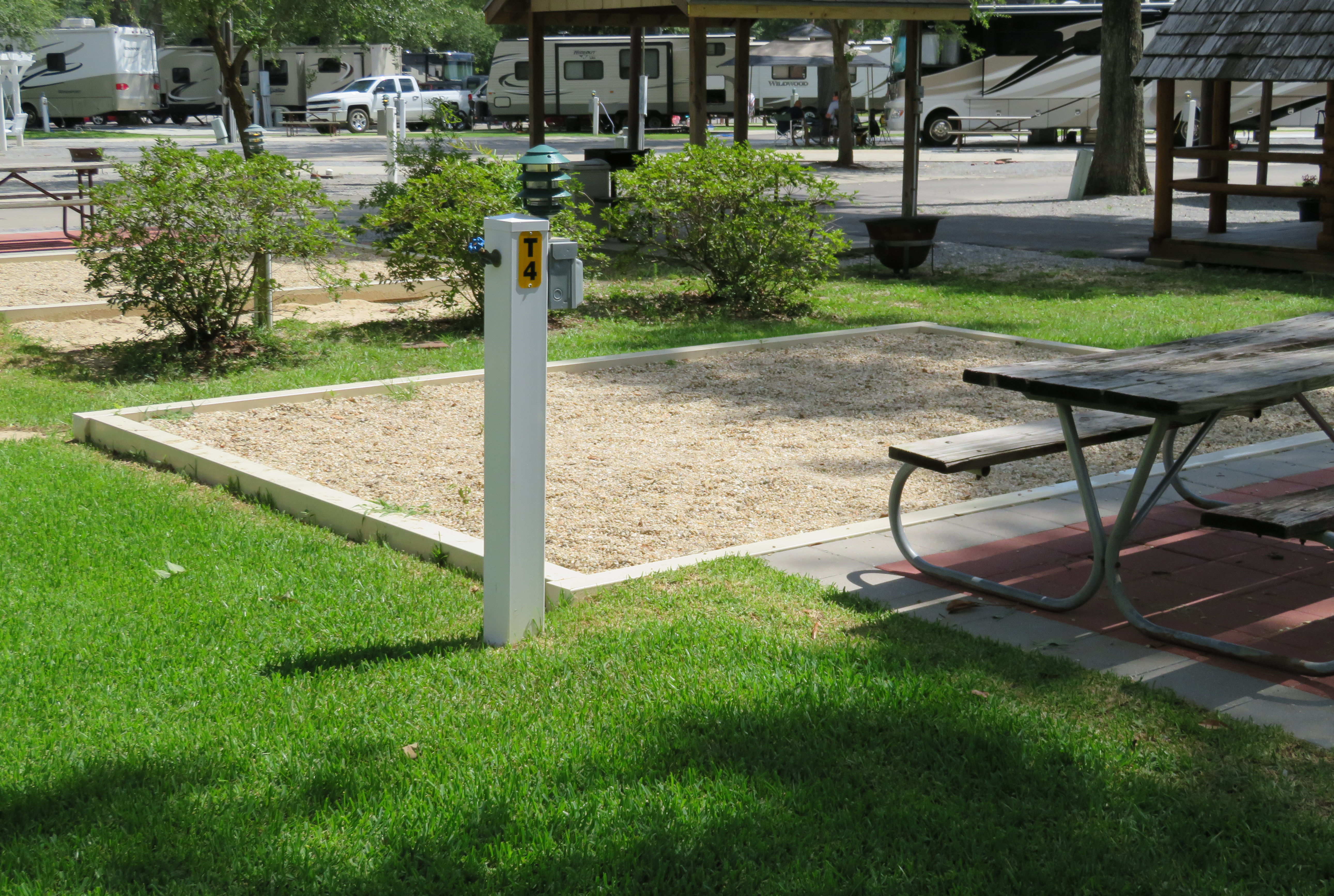 THIS IS AN EXAMPLE OF ONE OF OUR TENT SITES THAT ARE CONVENIENTLY LOCATED IN THE MIDDLE OF OUR CAMPGROUND SO YOU ARE NEAR THE BATH HOUSE/LAUNDRY AND STILL CLOSE ENOUGH TO THE POOL AND STORE TO GRAB AN ICE CREAM OR A SODA. THESE SITES INCLUDE 20 AMP ELECTRICITY, WATER, WIRELESS INTERNET, PICNIC TABLE AND FIRE PIT. THE TENT AREA IS A LIGHT PEA GRAVEL  AND HAS A PATIO .