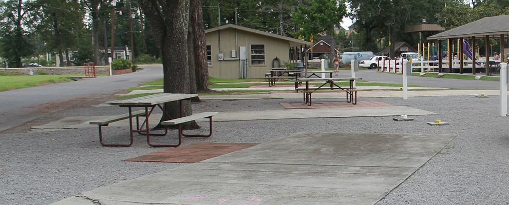 ONE OF OUR BACK-IN SITES FEATURING A PICNIC TABLE, WATER, SEWER, 50/30/20 AMP ELECTRICITY, CABLE, WIRELESS INTERNET.