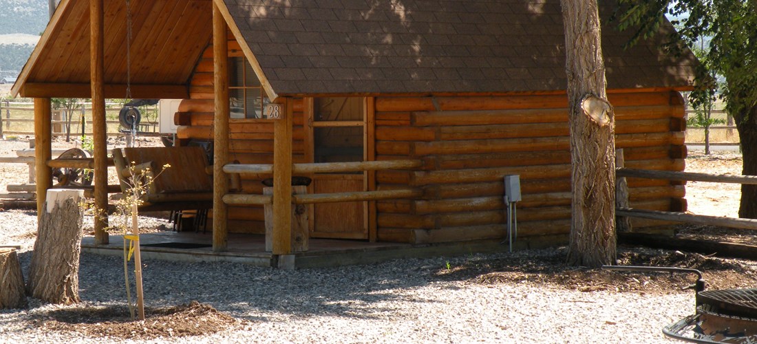 Single cabin Has a firepit, tv, electric outlet, Bring your own bedding. Use our showers and restroom.