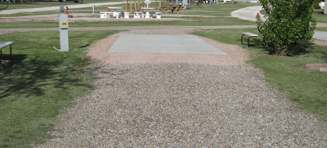 PULL THRU FULL HOOK UP SITE WITH CONCRETE PAD