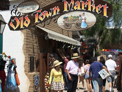 A crow of people are shopping in the Old Town Market near Old Town San Diego State Historic Park.