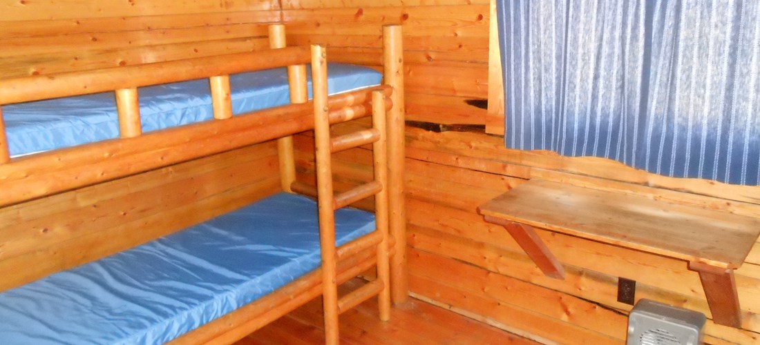 Two sets of bunk beds in second room of 2 room cabin