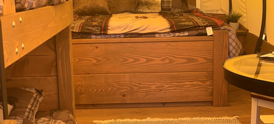 Don't let the word "wagon" fool you. Our Conestoga Wagons are spacious and have many of the comforts of home. Like a King Size Bed.