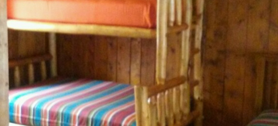 Open room w/log twin over full bunk & twin trundle & queen bed