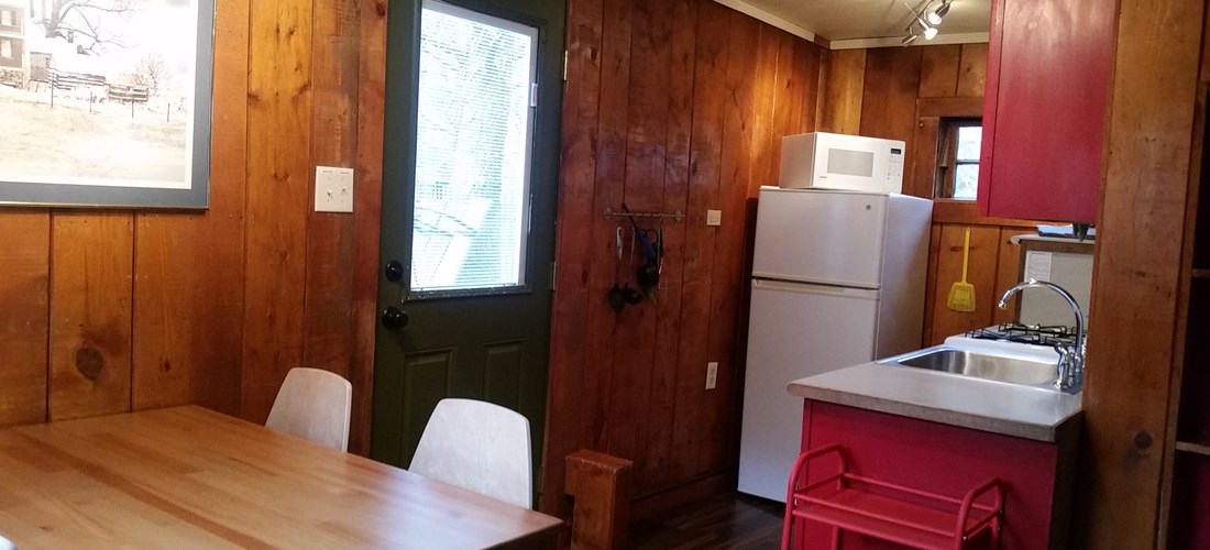 Fully stocked kitchen, dining table for 4, with more seating out the door on the patio!
