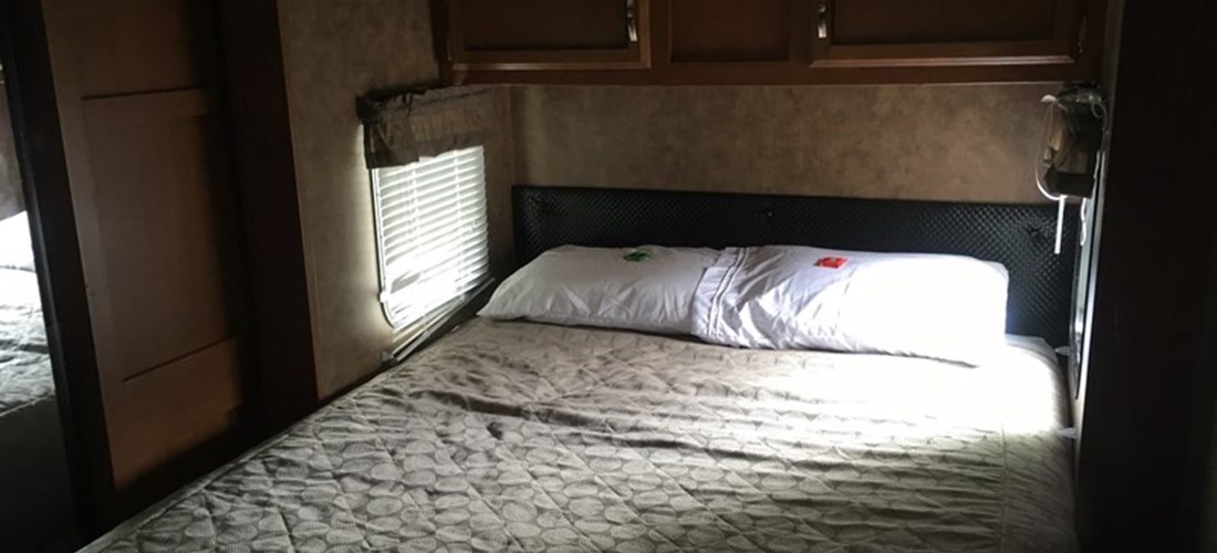 Rental trailer 149 master bedroom. Bedding and pillows are not provided.