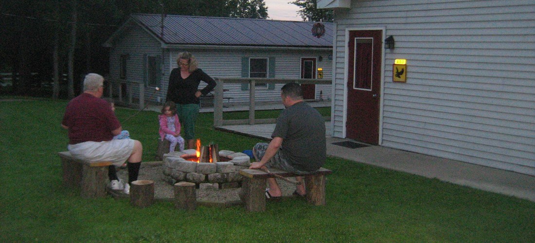 family enjoying a beautiful campfire