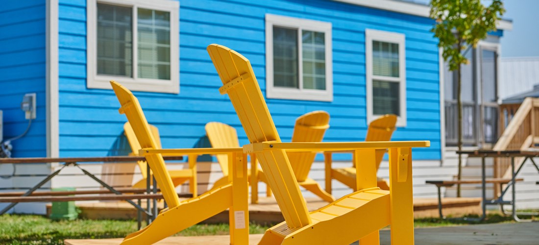 Chesapeake Bay KOA cabins come with private seating areas.