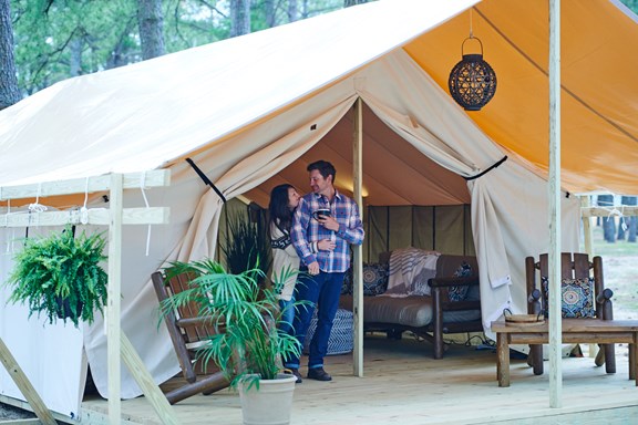 Safari tents at Chincoteague Island KOA come with furnished porches.