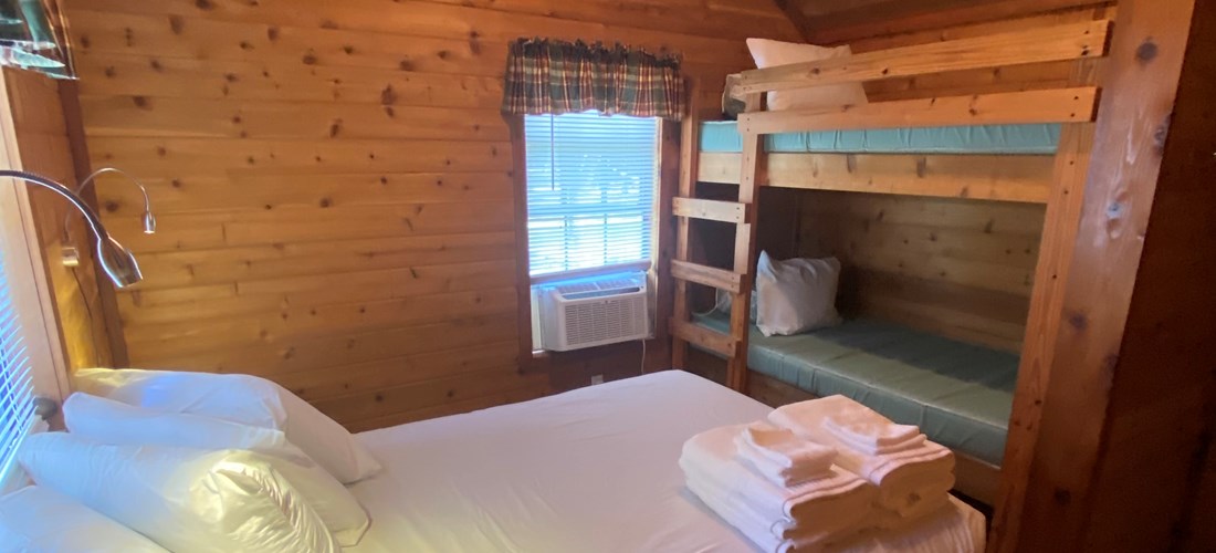 Deluxe cabin with swing bedroom, full-size bed with bunks