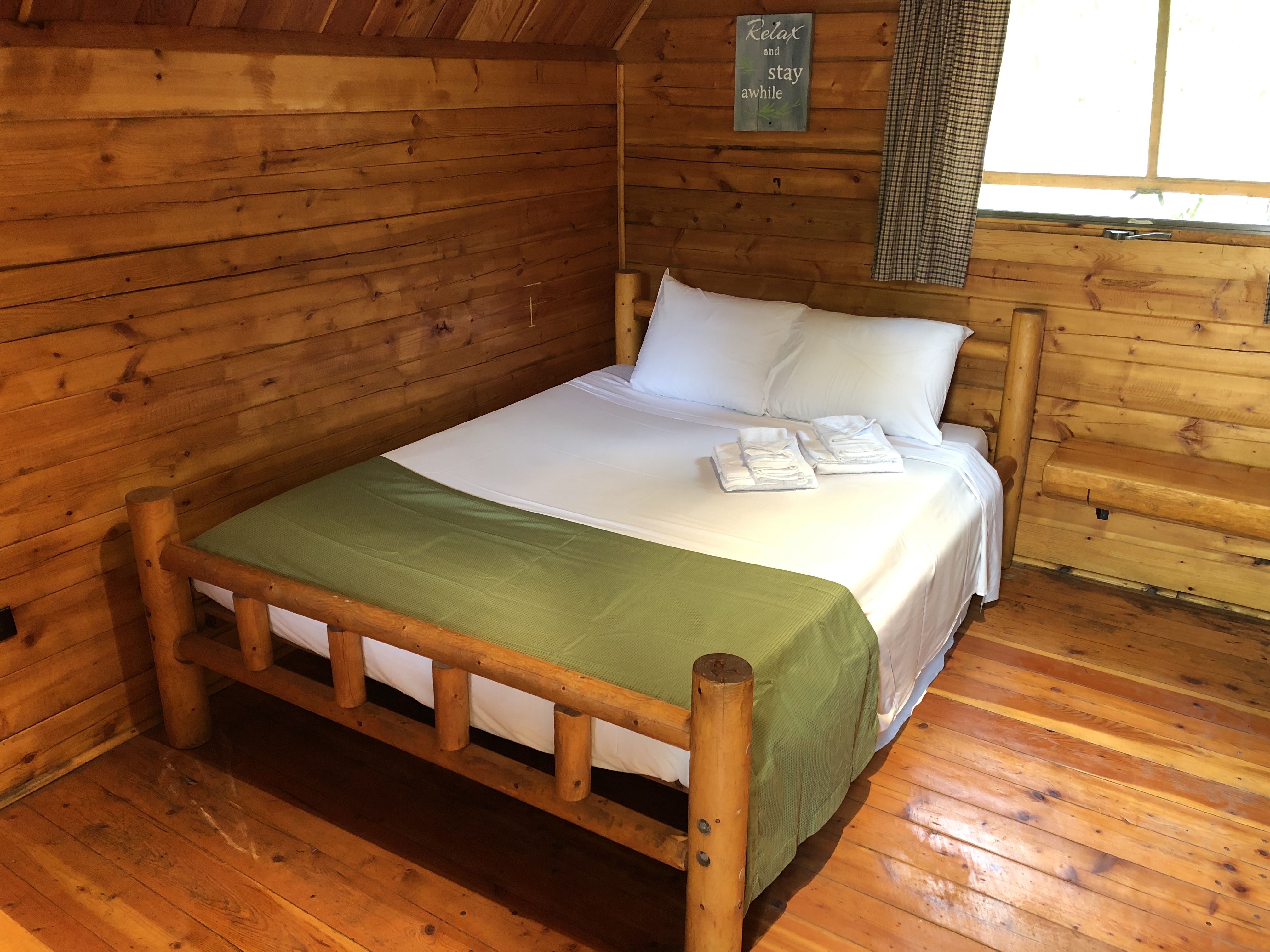 Camping Cabin full-size bed (shown with linen package).
